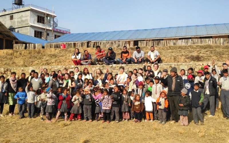 SIS students with school children in Nepal
