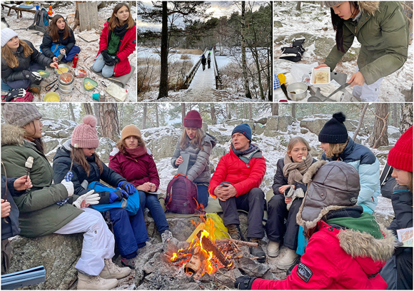 SIS students gathered around a fire in the woods